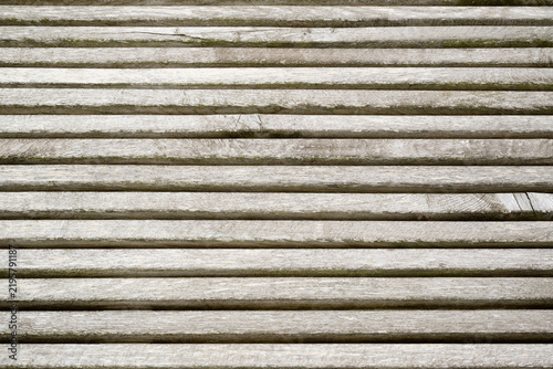Background created from a close-up of an outdoor deck made of wooden slats.