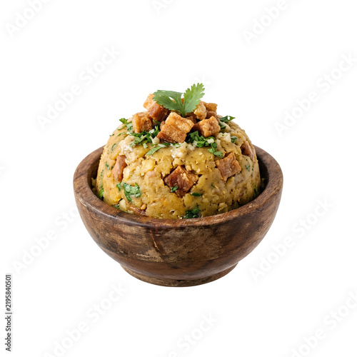 Puerto Rican mofongo in a wooden bowl topped with crispy pork cracklings isolated PNG. Traditional Puerto Rican dish isolated
