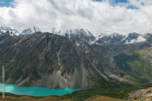 Landscape view of the Lower Shavlinskoye lake, glacial lake with turquoise and emerald waters surrounded by the Altai mountains, Russia
