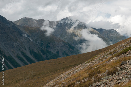 Landscape view of a picturesque Altai valley with mountain tops covered in clouds, Russian Federation, the Altai Republic