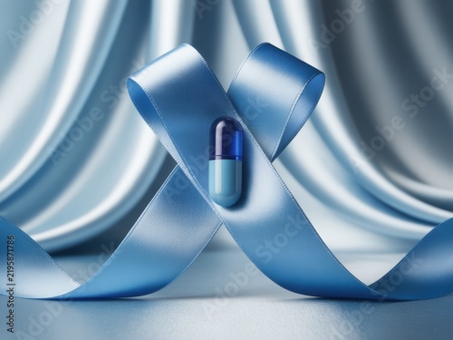 Blue awareness ribbon with a medical capsule pill in the center, set against a background of draped blue silk fabric, symbolizing healthcare, treatment, and medical research.