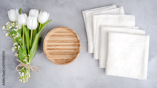 Modern Relaxation Concept with Floral Bouquet and Wooden Plate for Beauty and Lifestyle Themes