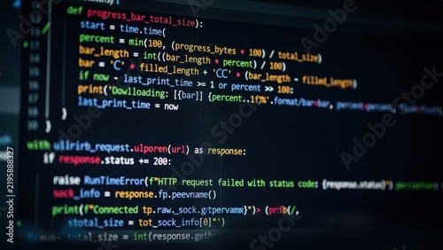 Software development source code displayed on a dark computer monitor screen