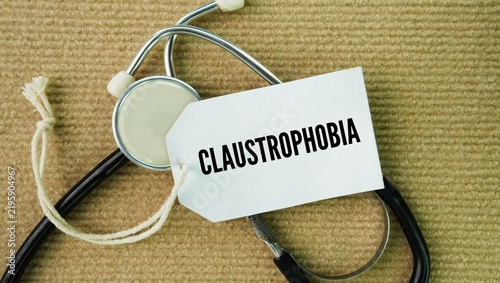 Фотография Stethoscope and paper tag with the word Claustrophobia