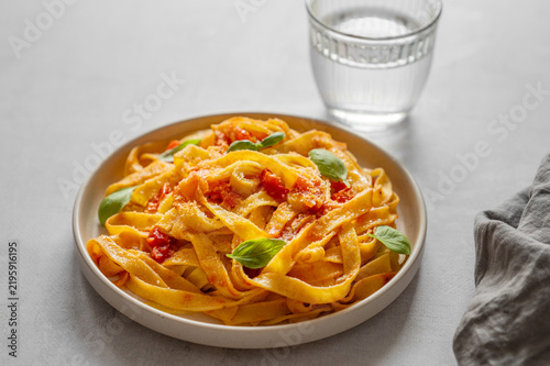 Homemade Tagliatelle Pasta with Tomato Sauce, Basil and Parmesan