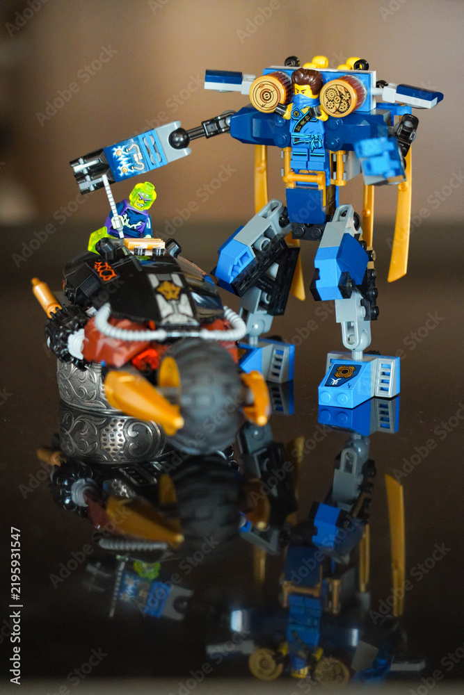 Obraz premium LEGO Ninjago mech and motorcycle battle scene displayed as a toy construction set, illustrating the popular building toy and entertainment franchise. February 3, 2021 - Abu Dhabi, UAE.