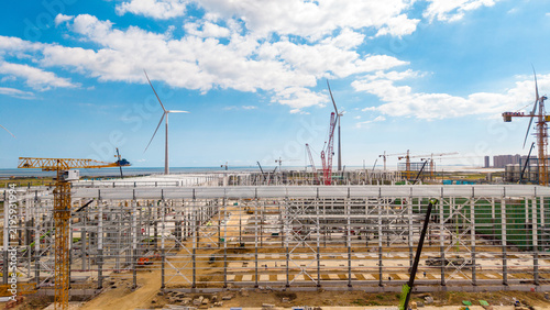 Foto Construction Site With Wind Turbines Under Clear Sky