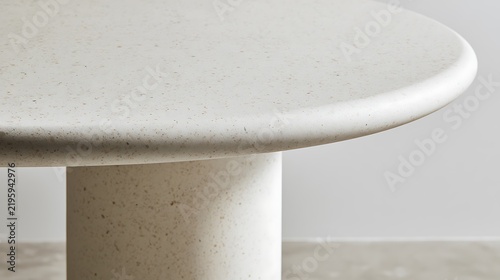 Minimalist Round White Concrete Pedestal Dining Table Close Up.