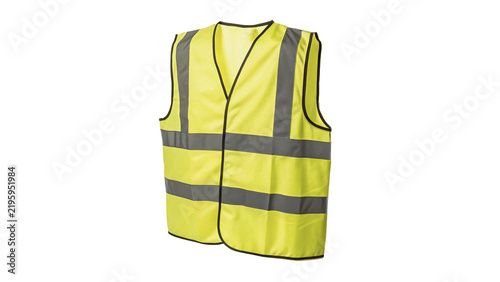 High visibility yellow reflective safety vest on dark background