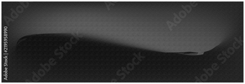 Close-up of a sleek black object on dark surface