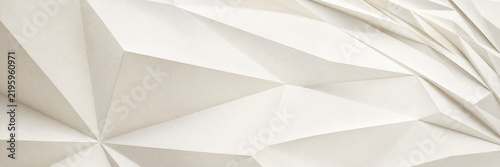 Minimalist white geometric background with 3D low poly texture. Abstract paper fold pattern with sharp triangular shapes and soft shadows. Modern architectural surface for web design.