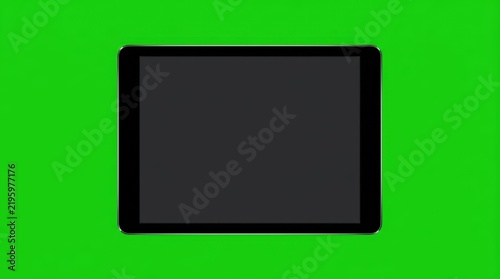 Digital tablet computer mockup with blank dark display screen isolated on green background for compositing