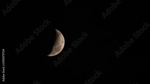 Tokyo,Japan - September 17, 2026: The crescent moon being covered with Moving clouds
