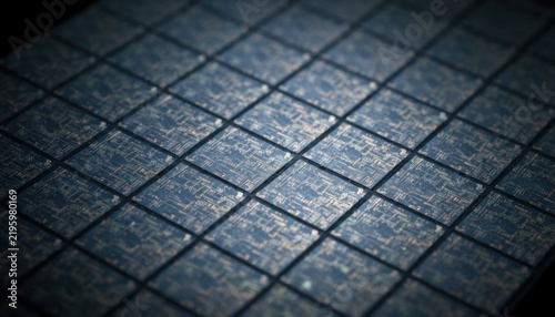 Detailed macro view of semiconductor wafer with golden circuitry patterns arranged in grid layout on dark surface