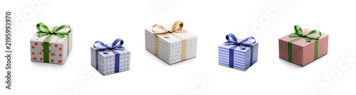 A collection of paler, lighter coloured blue and red gift wrapped presents with gold, blue and green ribbon bows isolated against a transparent background.