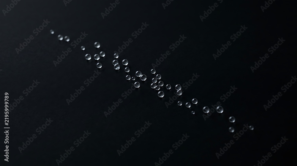 Obraz premium Scattered small clear droplets forming a diagonal line on a black background, keywords: scattered