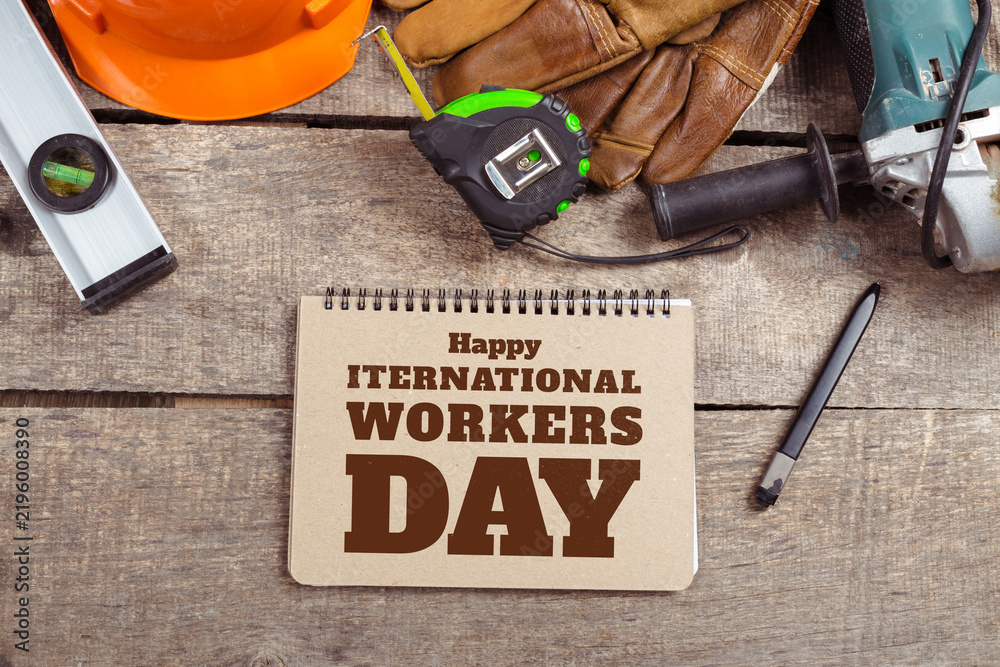 Naklejka premium Workers celebrate International Workers Day with tools and messages on May 1