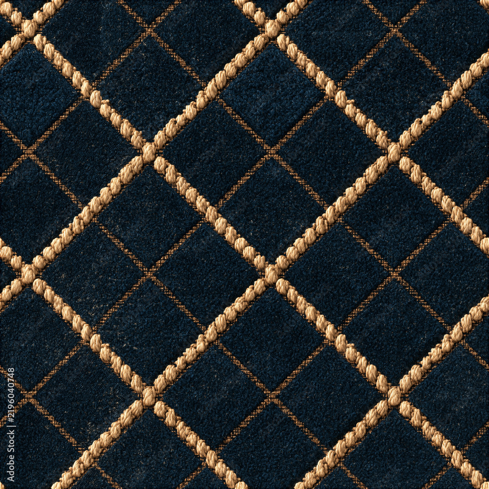 Fototapeta premium Seamless pattern navy blue velvet fabric forming a diamond pattern with intersecting golden ropes, creating a luxurious quilted background texture