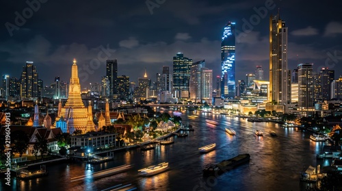 Bangkok Skyline at Night with Wat Arun and Chao Phraya River.