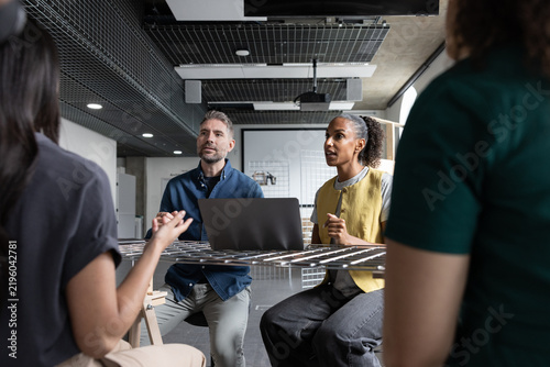 Group of engineers discussing developments in technology