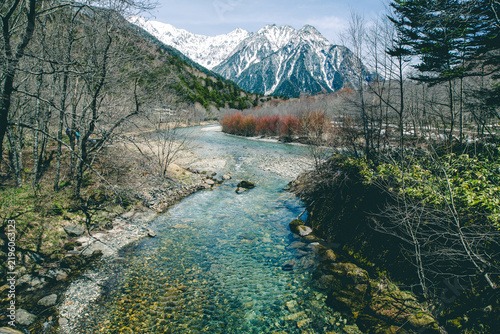 Clear river and snowy mountains in Kamikochi, Nagano, Japan