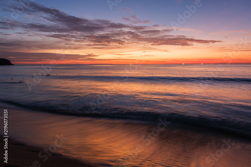 Natural seaside scenery of Kata Beach at sunset with afterglow in Phuket, Thailand