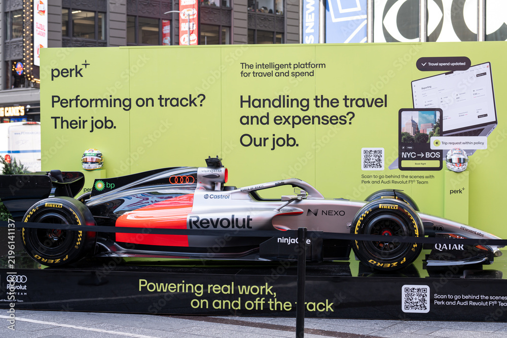Obraz premium NEW YORK, USA – SEPTEMBER 16, 2026: an Audi Revolut F1 Team Formula 1 car display in Times Square beside a Perk advertising panel.