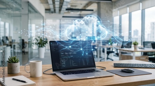 Laptop on office desk displaying digital cloud computing network visualization concept.