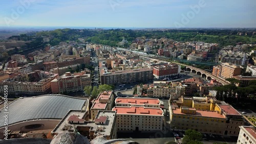 An aerial view reveals the sprawling historic cityscape of Rome with colorful rooftops under a sunny sky. Ancient European capitals inspire timeless travel experiences and architectural heritage.