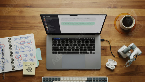 Overhead flat lay of modern developer workspace with AI and machine learning tools