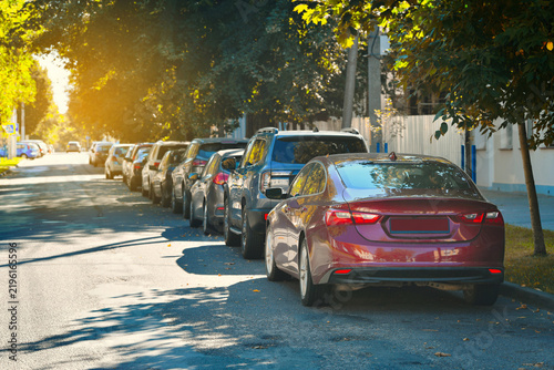 Densely packed parking lot in the city with rows of cars filling every available spot, severe shortage of free space and the challenges of urban vehicle storage during peak hours, crowded parking area