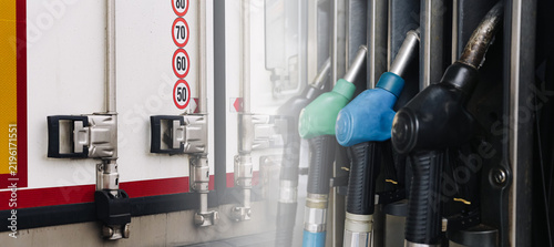 Canvastavla Fuel nozzles and truck trailer show transport cost background