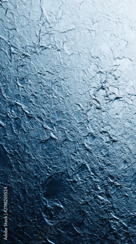 Frozen Texture Abstract: A close-up, abstract view of a frozen surface, showcasing intricate patterns and icy textures in shades of blue and white, with a gradient effect.