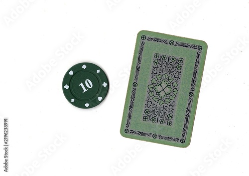 Photography A vintage playing card and poker chip isolated on a white background