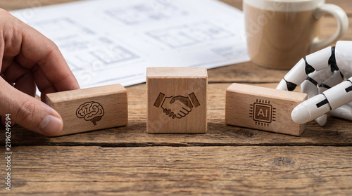 Human ai collaboration handshake brain robot hand wooden block business concept partnership teamwork technology
