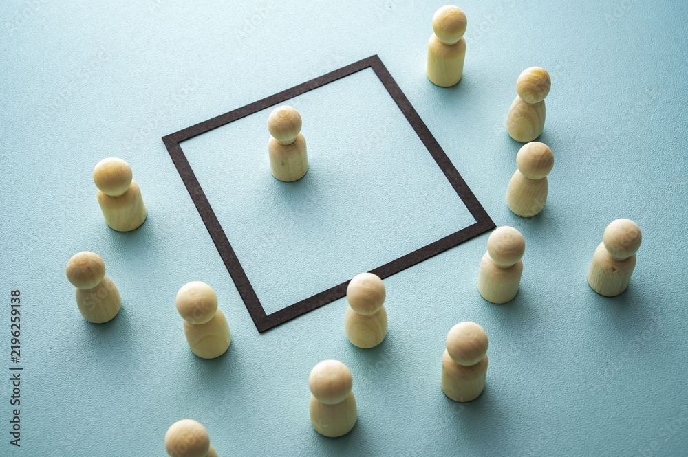 Obraz premium Concept of property, understood in both legal and social terms, represented by wooden tokens on a blue background.