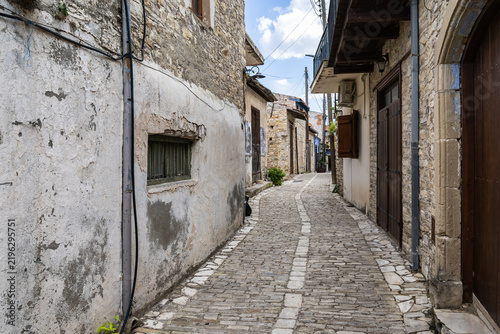 A quiet narrow Yiallouri street with the stone houses in mountain village Lefkara in Cyprus
