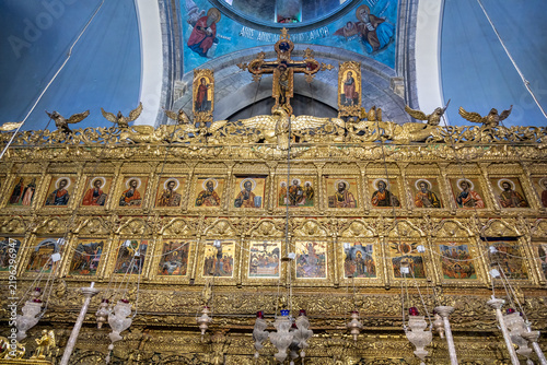 Large number of icons depicting saints and apostles in main hall in Church of the Holy Cross in mountain village Lefkara in Cyprus