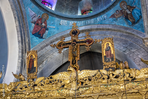 Картината върху платно Crucifix at top ornate gold decorated iconostasis in main hall in Church of the