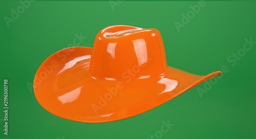Bright Orange Cowboy Hat on Green Background