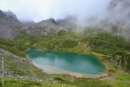 High-Angle View of Abujicuo Alpine Lake Surrounded by Rugged Mountain Peaks in Shangri-La, China
