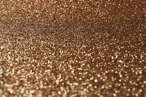 Shiny bronze background. Shimmering copper. Abstract shimmering texture. Surface sheen. Shimmering mockup.  Luxurious, festive background