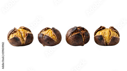 Four roasted chestnuts with naturally cracked shells and warm golden interiors, individually spaced to highlight their rustic texture and festive winter appeal. Isolated on White background.