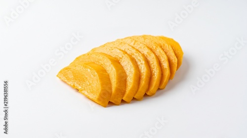 Sliced Sweet Potato: Vibrant orange slices of raw sweet potato are neatly arranged, showcasing their fresh texture and appealing color, ready for culinary creation.