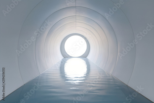 minimalist architectural tunnel with reflective water and bright circular opening