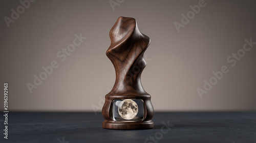 Abstract Carved Wooden Game Token Revealing a Miniature Full Moon in its Base