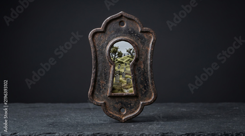 Antique Iron Keyhole Revealing a Miniature Surreal Cemetery Landscape