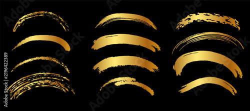 Set of shiny metallic gold brush stroke arcs with a glossy foil texture on a black background, ideal for luxury underline accents and premium branding design