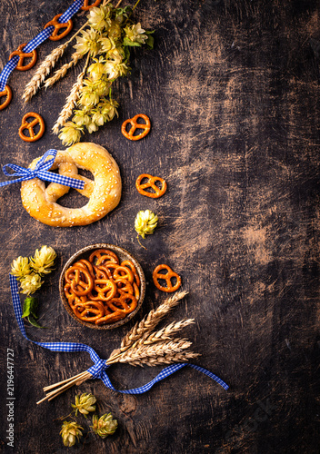 Oktoberfest background with brezel hops and malt with space for text