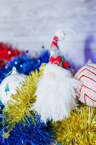 Christmas gnome ornament with festive tinsel and holiday decorations